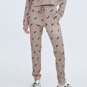NWT TNA Aritzia waffle all over logo joggers